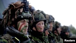 Lithuanian troops along with the other troops from 11 NATO nations take part in an exercise in urban warfare near Pabrade, Lithuania, Dec. 2, 2016. 