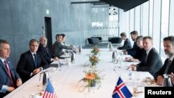 Icelandic Foreign Minister Gudlaugur Thor Thordarson meets with US Secretary of State Antony Blinken at the Harpa Concert Hall in Reykjavik, Iceland, May 18, 2021. (Saul Loeb/Pool via Reuters)