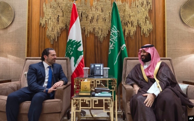 FILE - In this Oct. 30, 2017 photo, Saudi Crown Prince Mohammed bin Salman, right, meets with Lebanese Prime Minister Saad Hariri in Riyadh, Saudi Arabia.