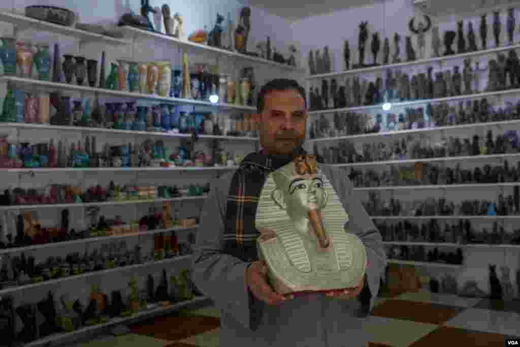 Despite the tourism boom, Abu Aish, an alabaster vendor, says people "are buying fewer and smaller souvenirs. Our profits are minimal.” (Hamada Elrasam/VOA) 