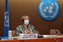 FILE - United Nations High Commissioner for Human Rights Michelle Bachelet looks on after delivering a speech on global human rights developments during a session of the Human Rights Council, in Geneva, June 21, 2021.