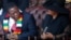 Zimbabwean President Emmerson Mnangagwa looks on next to his wife Auxillia Mnangagwa during the state funeral of the country's founder and longtime ruler Robert Mugabe