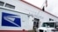 FILE - The entrance of a United States Post Office is seen in Manhasset, New York.