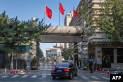 Chinese soldiers and security personnel secure the main entrance of the Jingxi Hotel, site of the Fourth Plenum of China's Communist Party Central Committee, in Beijing, Oct. 28, 2019.
