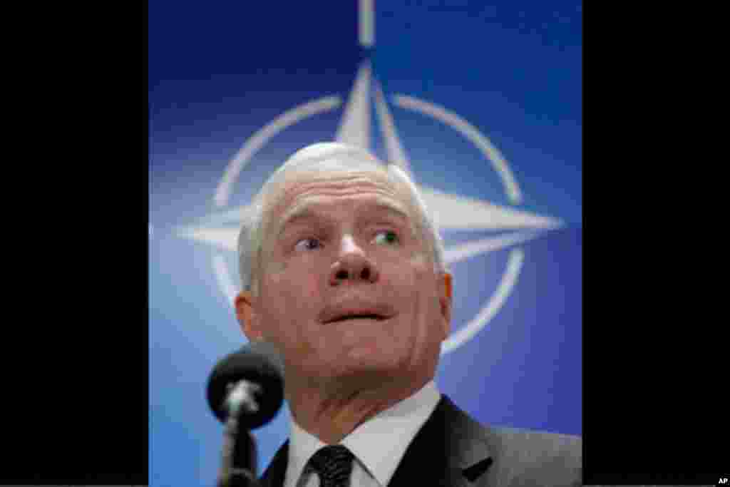 U.S. Defense Secretary Robert Gates speaks with the media after a meeting of NATO defense ministers at NATO headquarters on Thursday, March 10, 2011. NATO says it has started round-the-clock surveillance of the air space over Libya, where government jets 