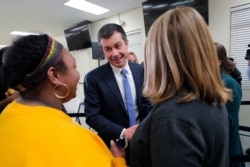 FILE - Democratic presidential candidate former South Bend Mayor Pete Buttigieg greets supporters after speaking at a campaign event in Sumter, S.C., Feb. 28, 2020.