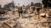 Marvin Meador walks on the remains of his fire-ravaged property after the Mountain Fire swept through, Nov. 7, 2024, in Camarillo, Calif.