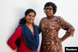 Kanaka Durga, 39 (L) and Bindu Ammini, 40, the first women to enter Sabarimala temple which traditionally bans the entry of women of menstrual age, pose for a photo on the outskirts of Kochi, India, January 10, 2019.