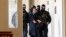 Policemen escort Salih Muslim, former co-chair of the Democratic Union Party, or PYD, to a court room for a custody hearing in Prague, Czech Republic, Tuesday, Feb. 27, 2018.
