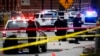 FILE - Crime scene investigators collect evidence from the pavement as police respond to an attack on campus at Ohio State University, in Columbus, Ohio, Nov. 28, 2016. 