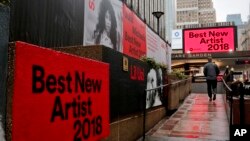 Signs posted around Madison Square Garden promote the return of the Grammy Awards to New York, Jan. 23, 2018, in New York. The Grammy Awards will be held on Sunday. 