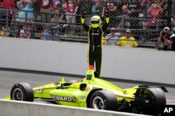 Simon Pagenaud, of France, celebrates after winning the Indianapolis 500 IndyCar auto race at Indianapolis Motor Speedway, Sunday, May 26, 2019, in Indianapolis.