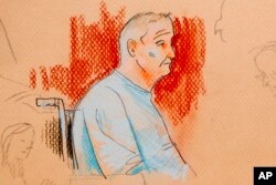 This courtroom sketch depicts Robert Gregory Bowers, who was wounded in a gun battle with police as he appeared in a wheelchair at federal court on Oct. 29, 2018, in Pittsburgh.