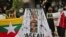 Activists display posters and defaced portraits of Myanmar's Commander-in-Chief Senior General Min Aung Hlaing during a rally against the military coup in Jakarta, Indonesia, April 24, 2021. 