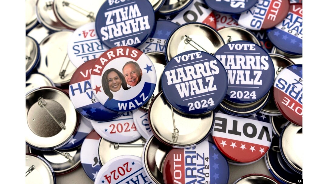 Campaign pins for sale are pictured before a rally for Democratic presidential nominee Vice President Kamala Harris at the Dort Financial Center in Flint, Michigan, Oct. 4, 2024.