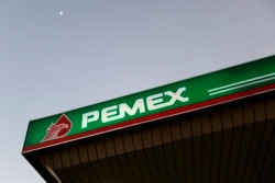 FILE - Part of a Pemex gas station canopy is seen in Mexico City.