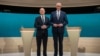 Social Democratic Party Chancellor Olaf Scholz and his conservative rival of the Christian Democratic Union Friedrich Merz are pictured in a studio of the ARD and ZDF television broadcasters ahead of their first TV debate in Berlin, Germany, Feb. 9, 2025.