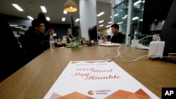 FILE - Employees of startup Chatting Cat work during a media tour at the Google campus in Seoul, South Korea, May 8, 2015. The company's Web page lists 500 Startups as an investor.