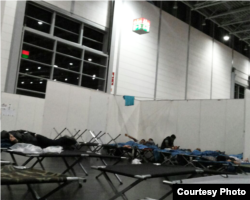 The German government has provided cots and space for refugees as thousands pour in. Refugees now in Germany say they fear the crowds coming in will make it impossible to sustain livable conditions. Courtesy photo from refugee in Germany, Sept. 19, 2015.