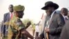 FILE - South Sudan's President Salva Kiir (R) is received by Chief of General Staff of the Sudan People's Liberation Army (SPLA) Paul Malong Awan at the airport in Juba, March 6, 2015, upon arriving after attending peace talks with rebel leader Riek Machar in Ethiopia's capital Addis Ababa.