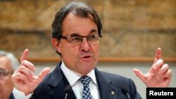 FILE - Catalan regional government head Artur Mas gestures at a public event in Barcelona on Dec. 17, 2013.