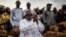 Adama Barrow, the flag-bearer of the coalition of the seven opposition political parties in Gambia, greets supporters during a gathering in the Buffer Zone district of Talinding, Nov. 29, 2016, on the last day of the presidential campaign in Gambia.