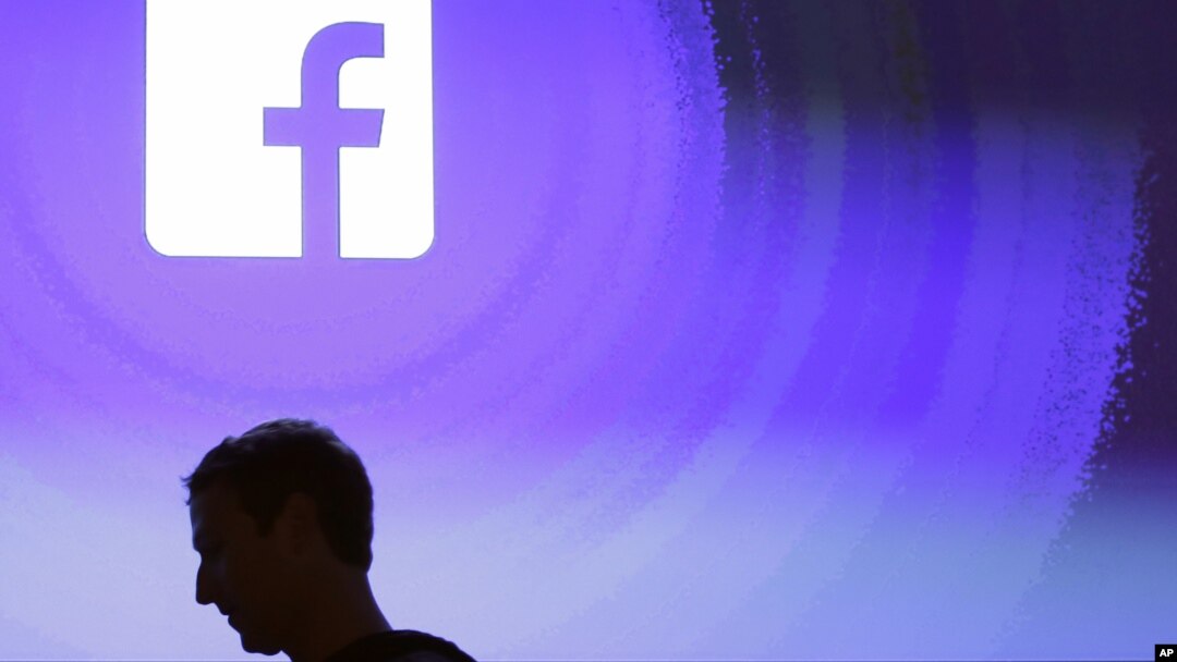 FILE - Facebook CEO Mark Zuckerberg walks at the company's headquarters in Menlo Park, California, April 4, 2013.