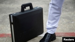 A briefcase with a hidden gun