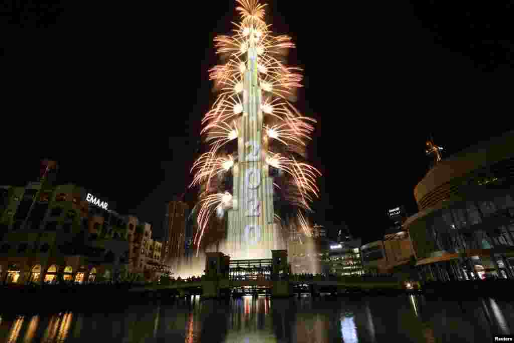 Fireworks explode around the Burj Khalifa, the tallest building in the world, during New Year&#39;s celebrations in Dubai, United Arab Emirates, Jan. 1, 2020.