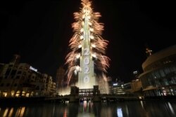 Fireworks explode around the Burj Khalifa, the tallest building in the world, during New Year's celebrations in Dubai, United Arab Emirates, Jan. 1, 2020.