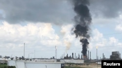Smoke rises from a fire at Exxon Mobil's refining and chemical plant complex in Baytown, near Houston, Texas, July 31, 2019. 