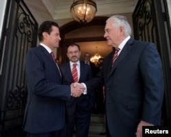 Mexico's President Enrique Pena Nieto shakes hands with U.S. Secretary of State Rex Tillerson at Los Pinos presidential residence in Mexico City, in this photograph from the Mexico Presidency, Feb. 2, 2018.