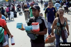 A man sells medicine on the street, in Villa del Rosario, Colombia, Feb. 5, 2019.