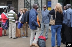 FILE - Aid workers from various NGOs active in South Sudan arrive at Wilson airport in Nairobi, Kenya, July 13, 2016, from Juba.