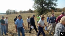 Afghan Agriculture Minister Asif Rahimi tours an Indiana farm with members of the Agriculture Development Team that worked closely with him in Afghanistan in 2009.