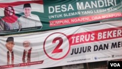 Spanduk kampanye Pilkada di Yogyakarta (Foto: VOA/Nurhadi).