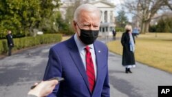 President Joe Biden speaks to reporters on the South Lawn of the White House in Washington, before boarding Marine One helicopter, Feb. 27, 2021.