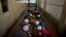 In this Feb. 1, 2015 photo, Pakistani students of a madrassa, or Islamic school, eat their lunch at their seminary in Islamabad, Pakistan. 