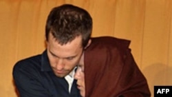 Detained US hiker Shane Bauer hugging his mother Cindy Hickey in Tehran.