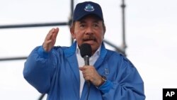 Nicaragua’s President Daniel Ortega speaks to supporters in Managua, Nicaragua, Aug. 29, 2018. A United Nations report released Wednesday calls on Ortega's government to immediately halt the persecution of protesters and disarm the masked civilians who have been responsible for much of the killings and arbitrary detentions. 