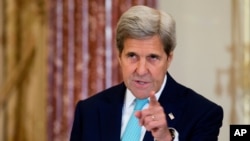 Le secrétaire d'Etat John Kerry américain le` 30 juin 2016, dans la salle Ben Franklin du Département d'Etat à Washington, USA. 