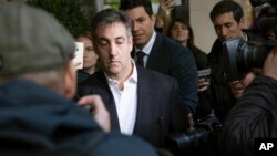 Michael Cohen, former attorney to President Donald Trump, leaves his apartment building before beginning his prison term, May 6, 2019, in New York.