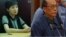 中共前高级领导人薄熙来的妻子薄谷来开和原铁道部部长刘志军(资料照片)。