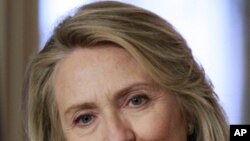 Secretary of State Hillary Clinton listens to a reporter's question during a news conference at the Department of State in Washington, Monday, April 30, 2012.