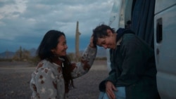 In this photo, director Chloe Zhao, left, appears with actress Frances McDormand on the set of "Nomadland."