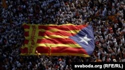 Spain - FILE PHOTO: Catalan pro-independence supporters hold a giant "estelada" during a demonstration in Barcelona