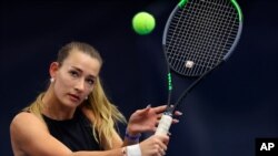 File - Russian tennis player Yana Sizikova poses for a photo during the Winter Moscow Open 2021 tennis tournament in Moscow, Russia, Feb. 24, 2021. 