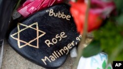 This is a painted rock in memory of Rose Mallinger, 97, found on Oct. 31, 2018 as part of a makeshift memorial outside the Tree of Life Synagogue in the Squirrel Hill neighborhood of Pittsburgh, to the 11 people killed during worship services on Oct. 27, 2018. 