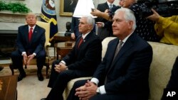 President Donald Trump listens to a question during a meeting with Finnish President Sauli Niinisto in the Oval Office of the White House in Washington on August 28, 2017. From left are, Trump, Vice President Mike Pence, and Secretary of State Rex Tillerson. (AP Photo/Evan Vucci)