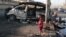 A boy stands at the site of a car bomb explosion in Sadr City, northeastern Baghdad, October 28, 2012.